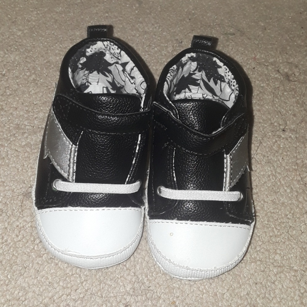 Black and Silver soft bottom lightning bolt shoes